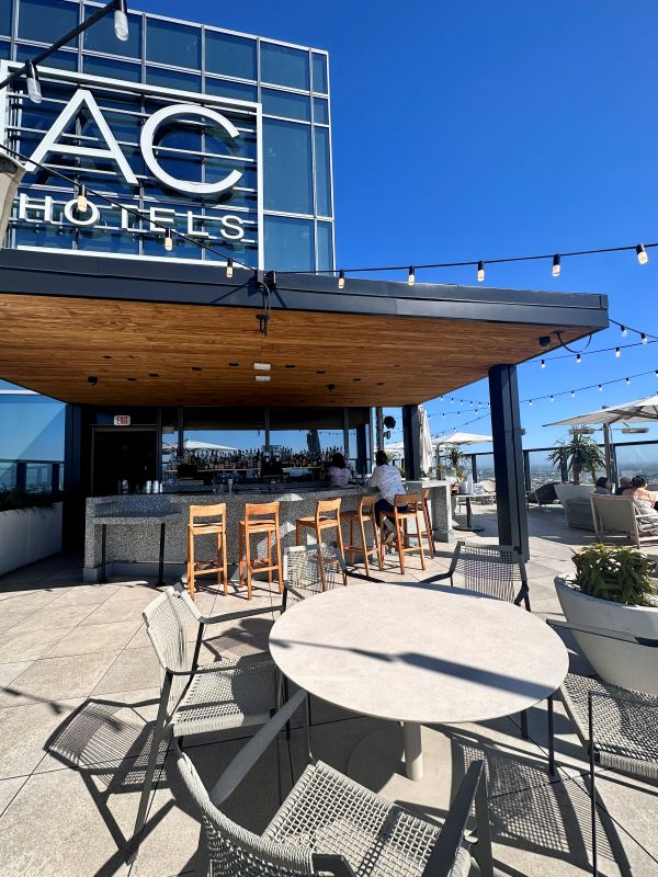 AC HOTELS sign above the roof of over the bar at the rooftop bar at the AC Hotel Brand in LA Downtown.