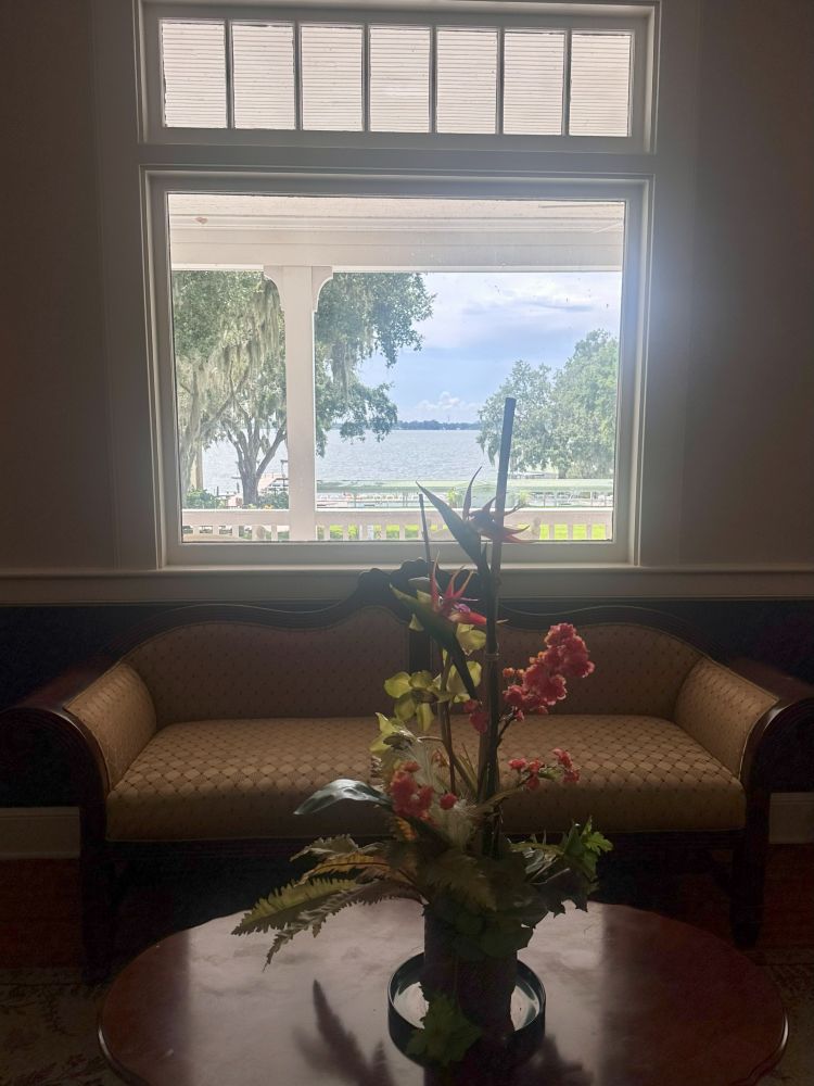 A view of the lake through the window from inside the lobby at the Lakeside Inn in historic Mount Dora.