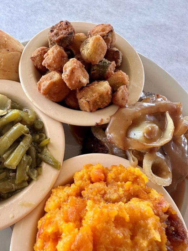 A meal at the former Biscuit Company ,with fried okra, mashed sweet potatoes and green beans, at the former Biscuit Company, a restaurant in Vicksburg.