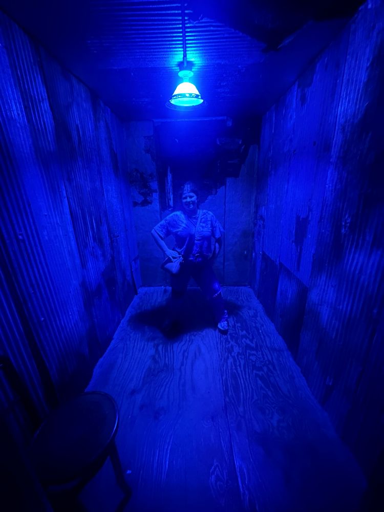 My granddaughter in the morgue in the basement of the Crescent Hotel on our ghost tour during our weekend in Eureka Springs.