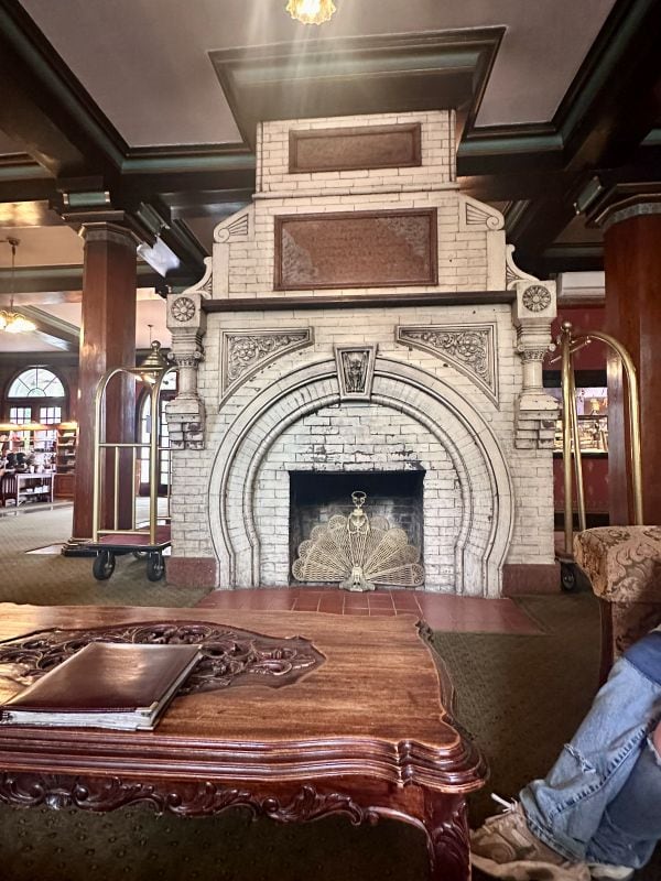 The elaborate white stone or mable fireplace in the lobby of the 1886 Crescent Hotel, on our weekend in Eureka Springs.