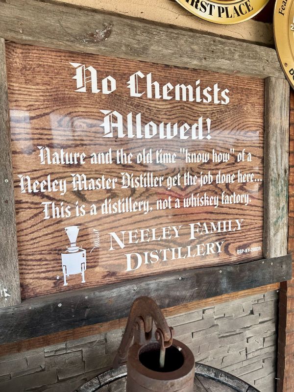 A "NO Chemists Allowed" sign at the entrance of the Neeley Family Distillery.