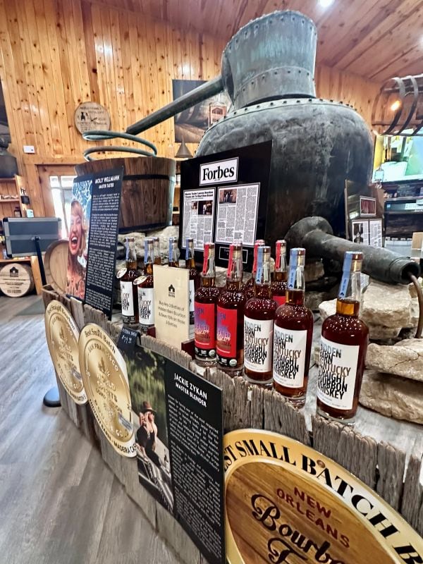 Inside Neeley Family Distillery and shelves of bourbon.