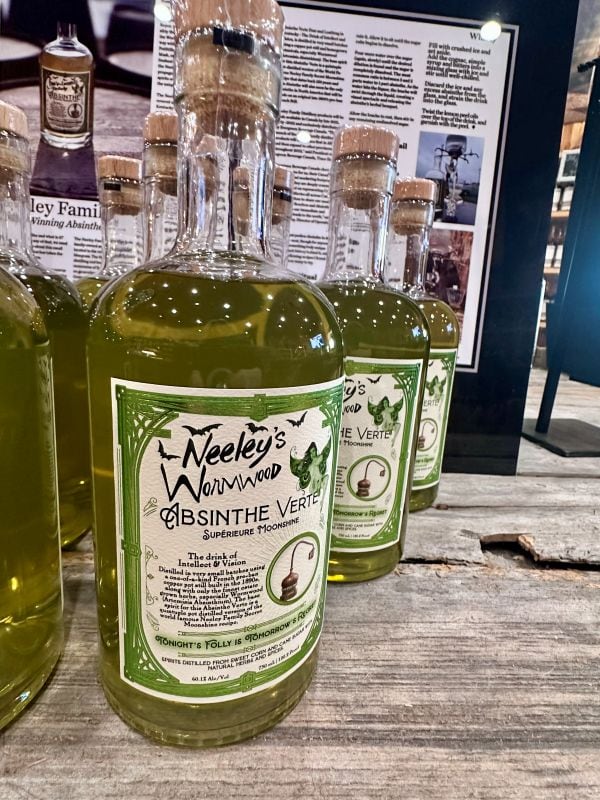 Bottle of green Absinthe on the shelf at Neeley Family Distillery.