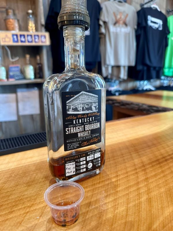 A bottle of Kentucky Single Barrel Straight Bourbon Whiskey, 117 proof on the bar ready for tasting at Neeley Bourbon.