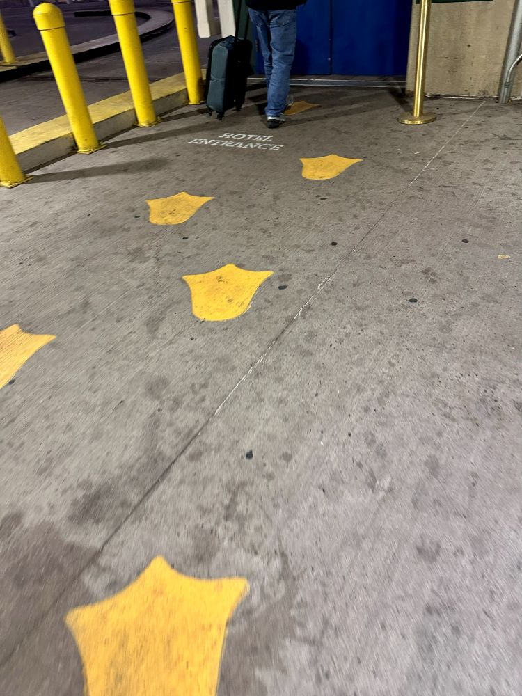 Yellow duck tracks painted on the garage floor at the Peabody Hotel in Memphis TN