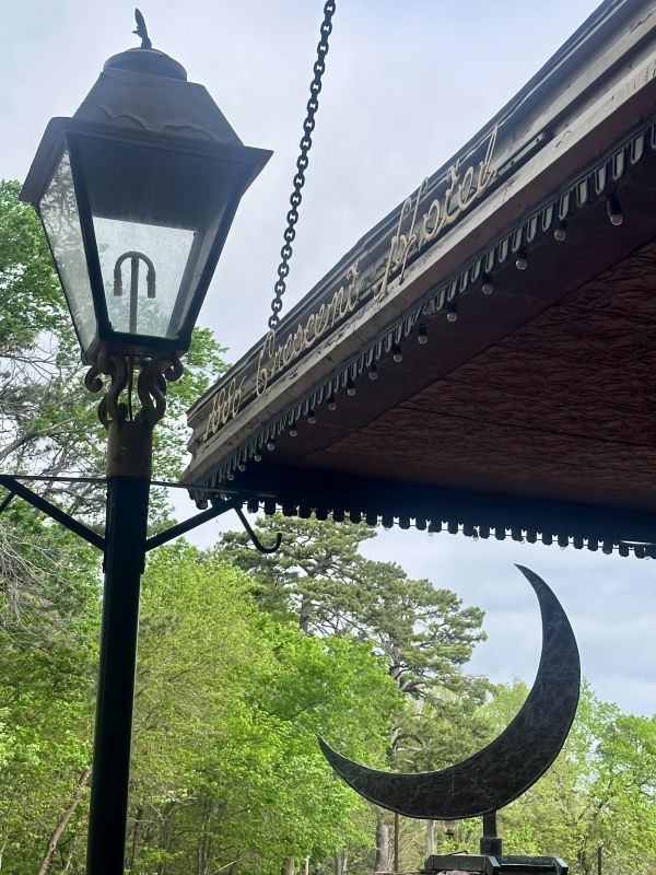 The lamppost, a crescent moon and the overhang with the name of the 1886 Crescent Hotel Eureka Springs.