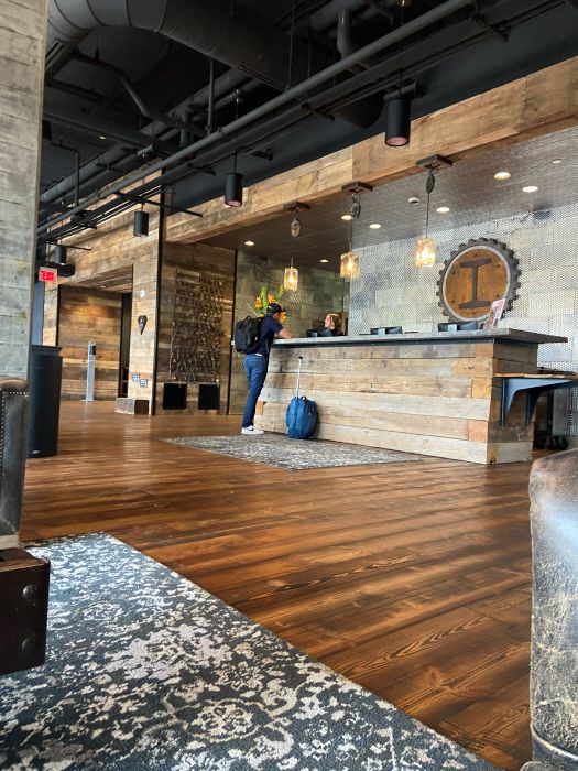 The lobby full of wood and metals at the Ironworks Hotel, an industrial style hotel in Indianapolis.
