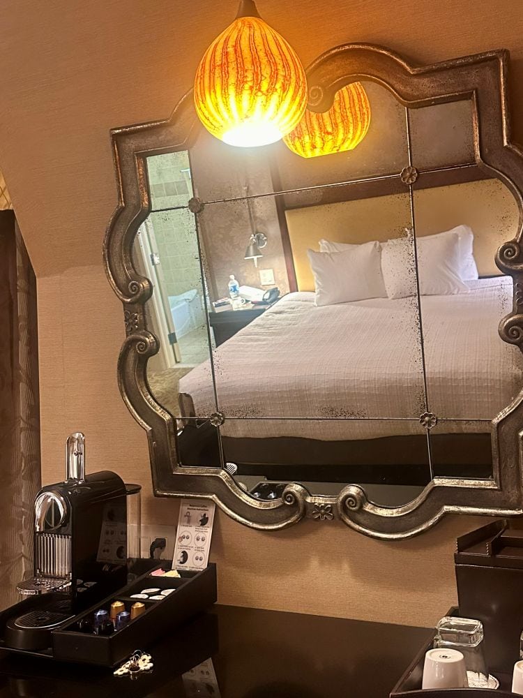 A guest room, looking at the bed through the mirror at the Chestnut Hill Hotel, Philadelphia off the beaten path.