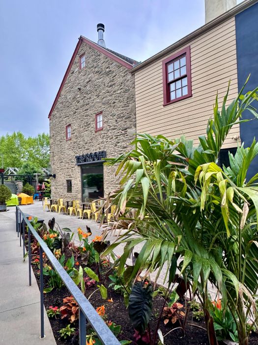 Off the courtyard and part of the historic grounds with stone brick building at the Chestnut Hill Hotel, Philadelphia off the beaten path.