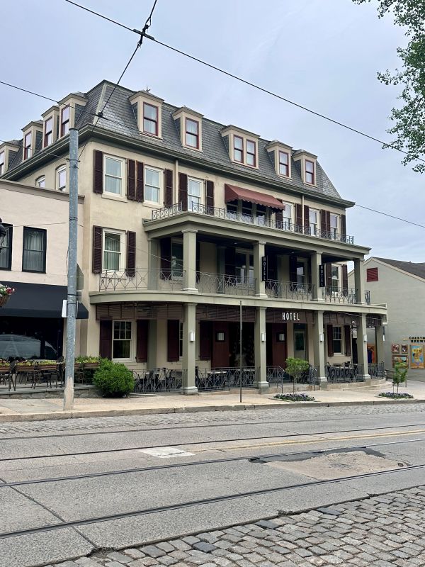 The exterior of this four story historic building, the Chestnut Hill Hotel, Phildelphia off the beaten path.
