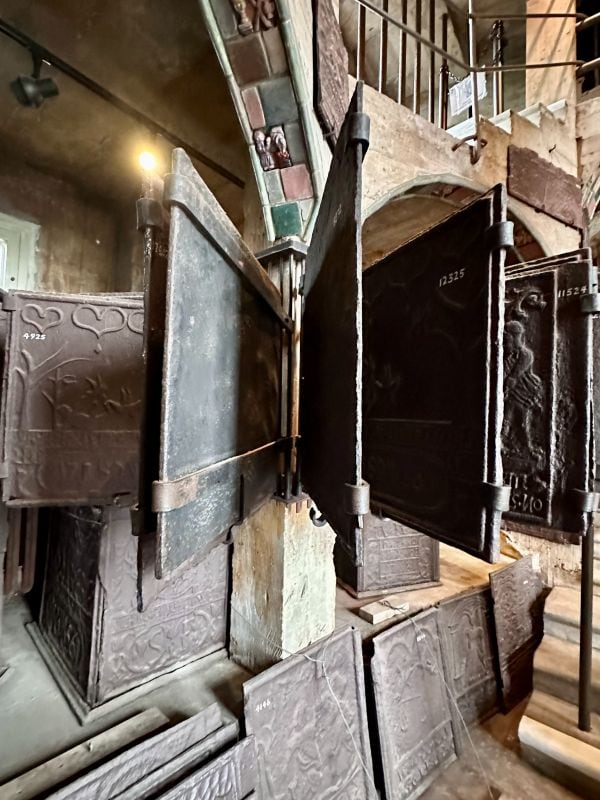 A row of metail fire grates hanging on display at the Mercer Museum, Philadelphia off the beaten path.