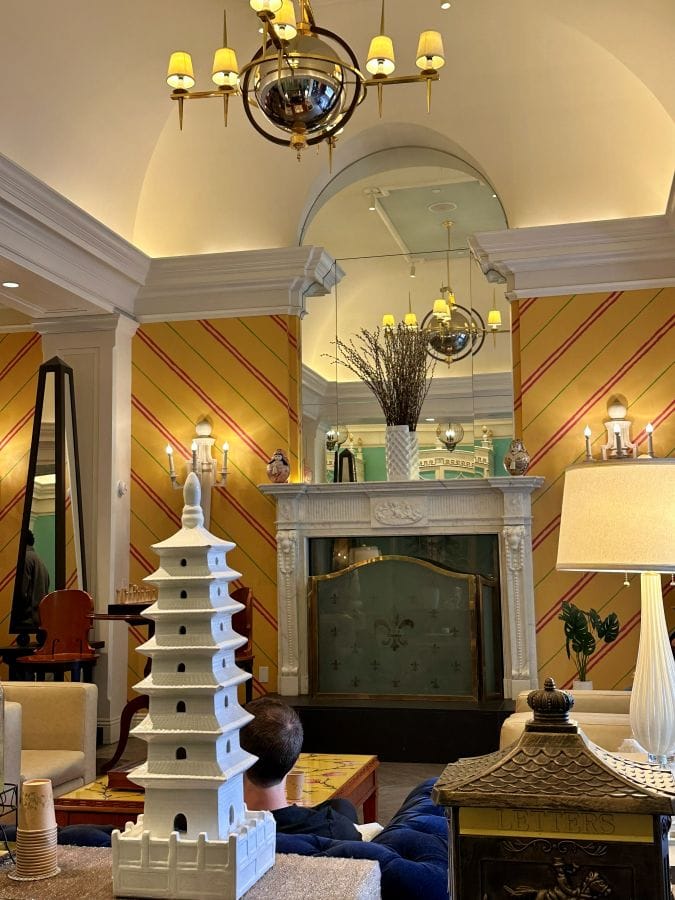 The whimsical lobby with yellow wallpaper and Japenese pagoda-inspired ceramics at the Kimpton Monaco, a hotel near Independence Hall.