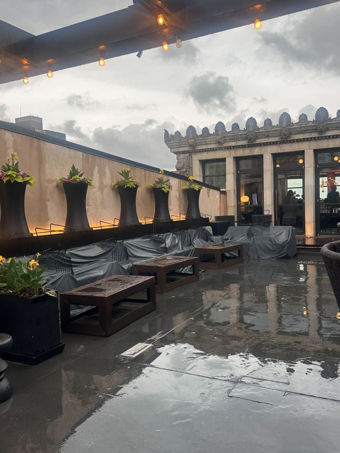 The open air patio of the Stratus Lounge, on a rainy day at the Kimpton Monaco, a hotel near Independence Hall.
