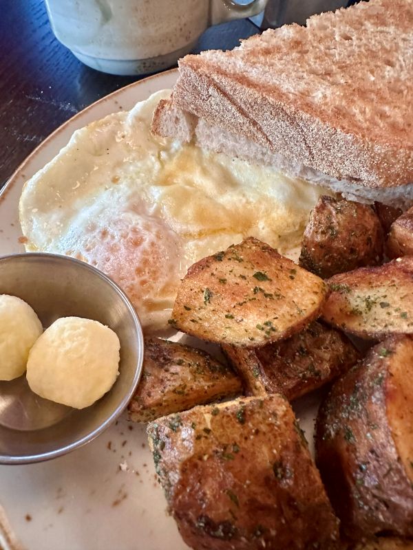 A plate of eggs and potatoes at the Red Owl Tavern.