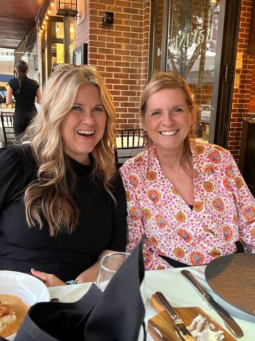 Me and a friend sitting at an outdoor table at BoVine in Winter Park Floriday.