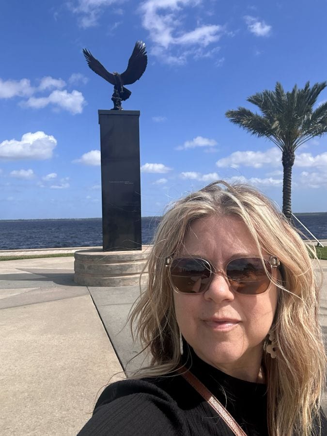 Me in front of the bronze eagle monument at the tip of the pier that is Veterans Memorial Park in Sandford Florida.