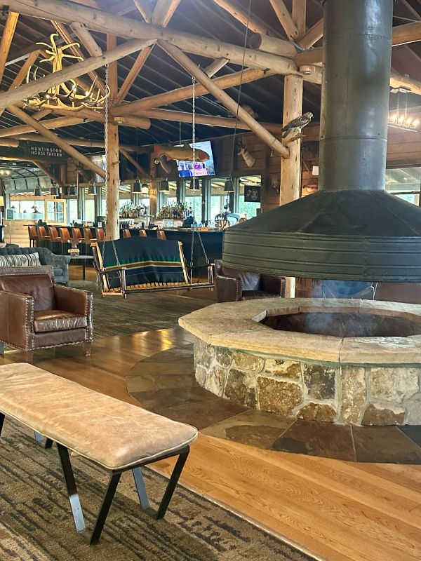 The large stone, round firepit in the middle of the lobby at Grand Lake Lodge on my Colorado mountain retreat.