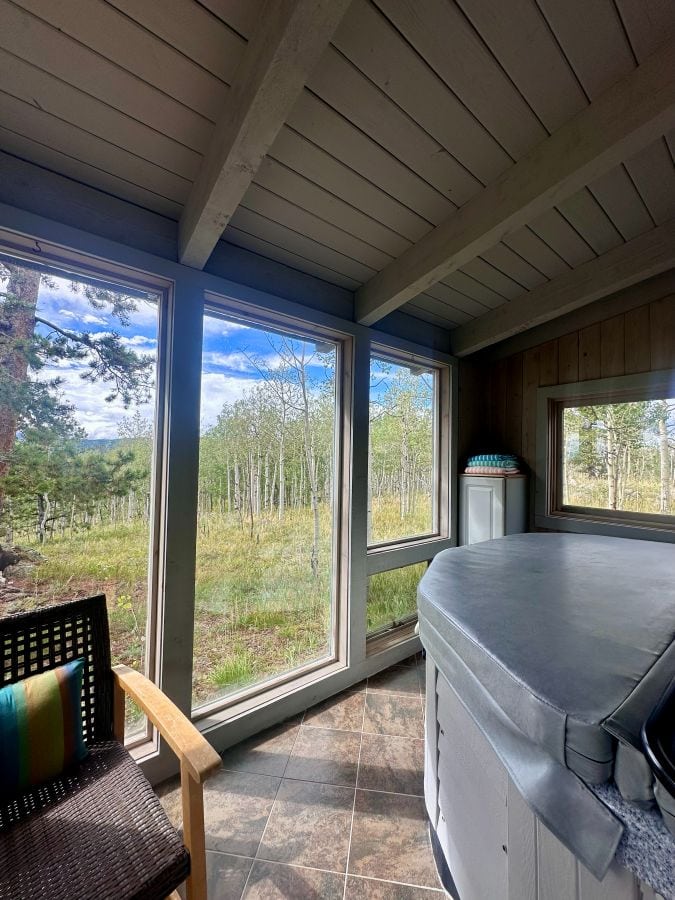 A view from the hottub room with a surround og floor to ceiling windows at Alpina Haus