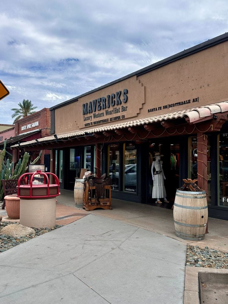 Exterior view of Maverick's Hat Bar and Rusty's Cowboy Saloon in Old Town Scottsdale, Arizona with rustic decor and outdoor seating.