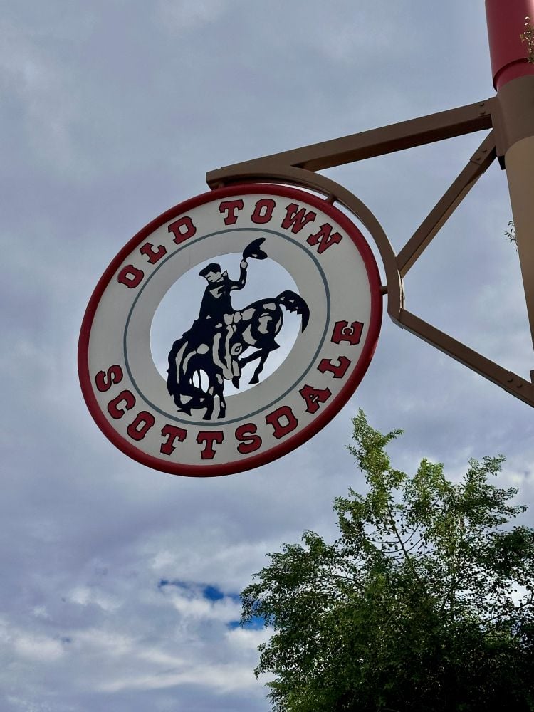 Vintage Old Town Scottsdale Arizona sign with cowboy riding a horse.