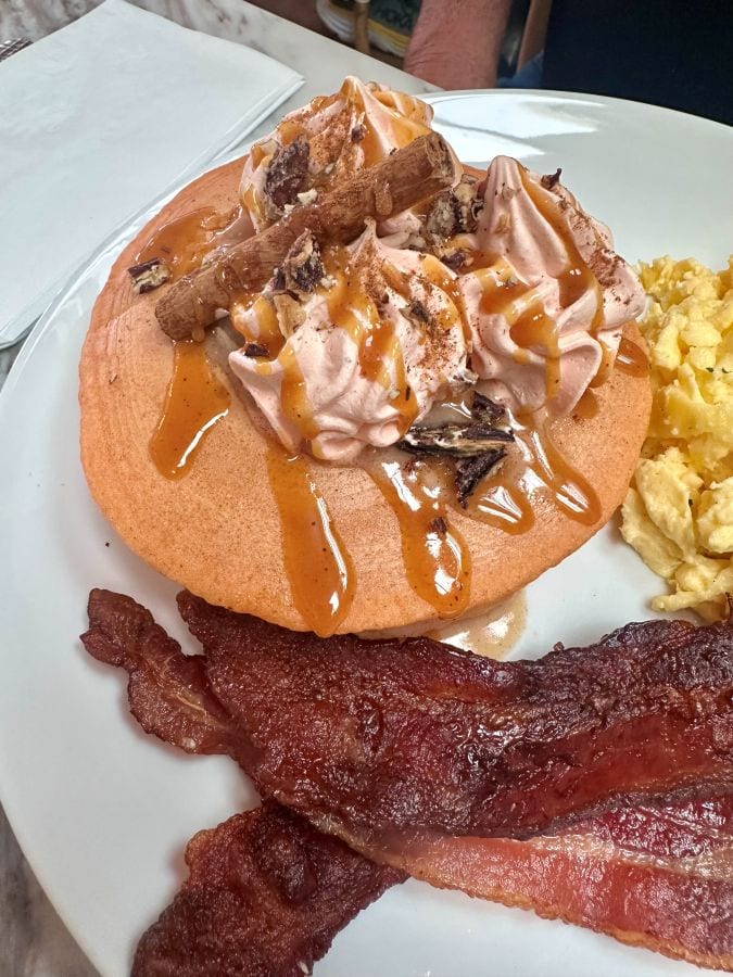 Delicious breakfast with pancakes, bacon, and scrambled eggs at JoJo Coffeehouse in Scottsdale.