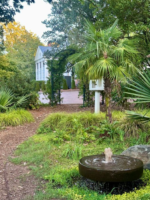 A peek at the house from the gardens at the Duke Mansion