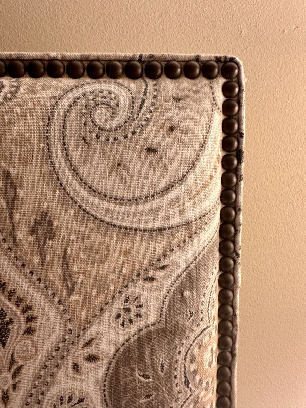Close up of the headboard with a pasiley like detail at the Duke mansion.