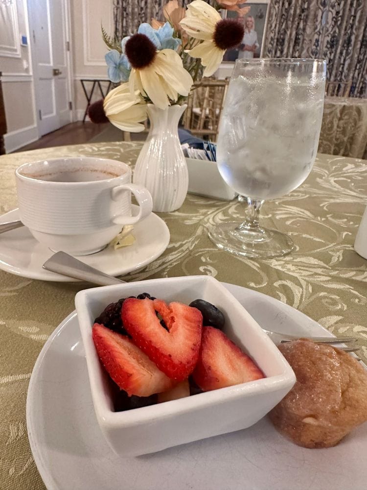 A fruit cup and muffin, first course of breakfast at the Duke Mansion.