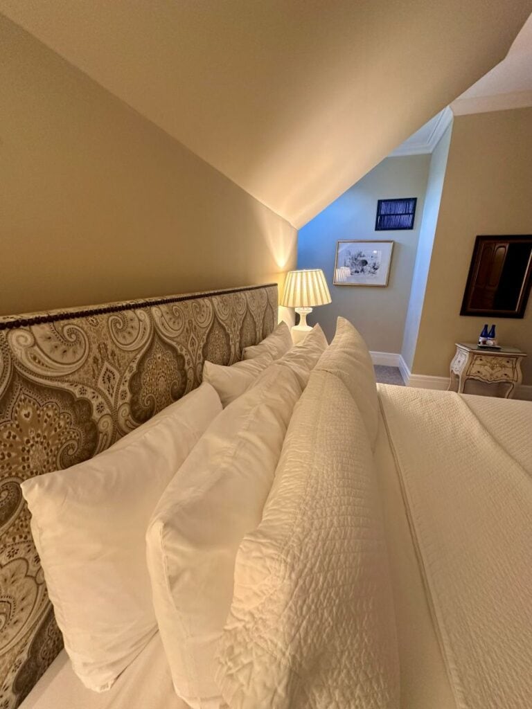 the pillows and headboard in a third floor guest room.