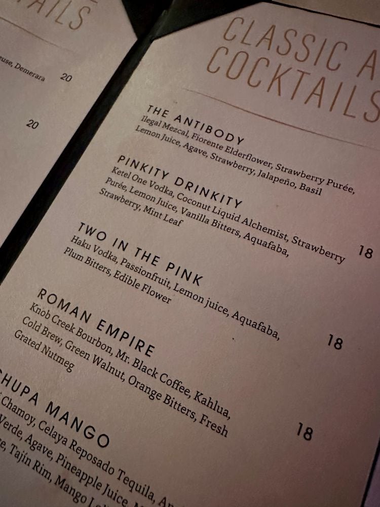 Close-up of cocktail menu featuring classic drinks and ingredients at The Beverly, in Old Town Scottsdale, Arizona.
